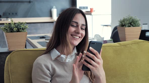 Relaxed Young Woman Smiling Using Smart Phone Texting Messages Checking News Surfing Social Media