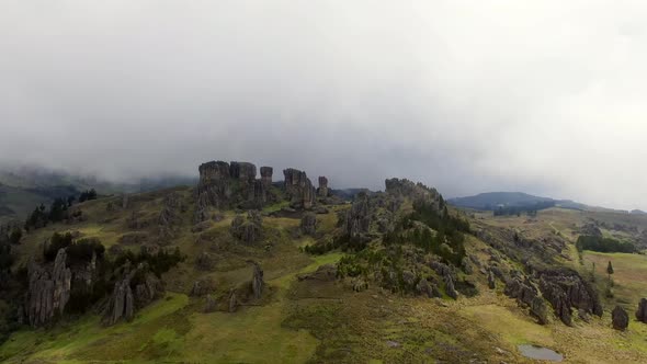 Cumbemayo Archaeological Site At The Green Hill On A Cloudy Day In Cajamarca, Peru. aerial, forward