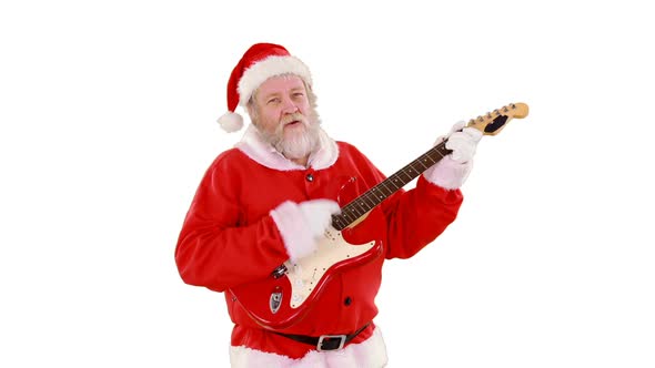 Santa claus singing a song and playing guitar