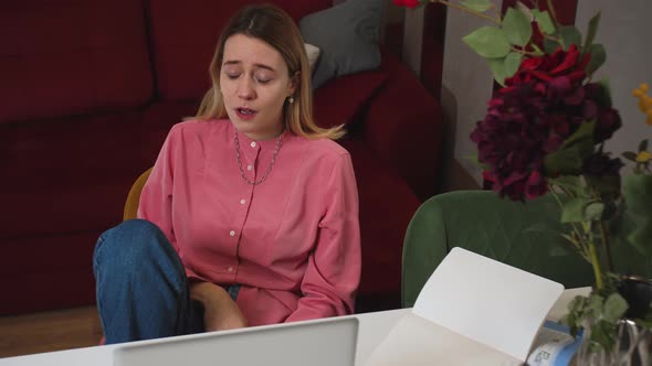 Depressed Woman Cry with Laptop Sitting at Home While Talking on Video Call Chatting