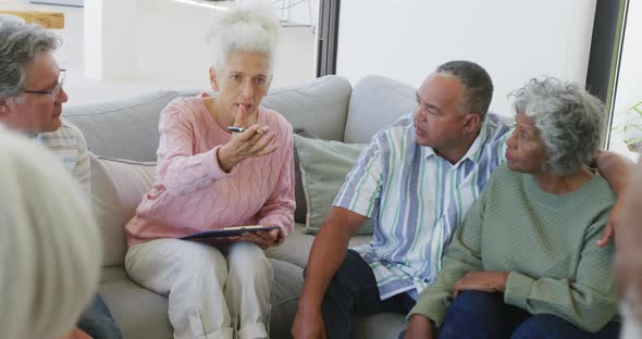 Senior diverse people at meeting talking at retirement home