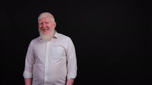 Portrait of Funny Bearded Man with Albinism Showing Victory Symbol with Fingers