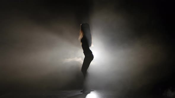 Silhouette Sexy Girl Dancing in a Smoky Studio Twerk Dance