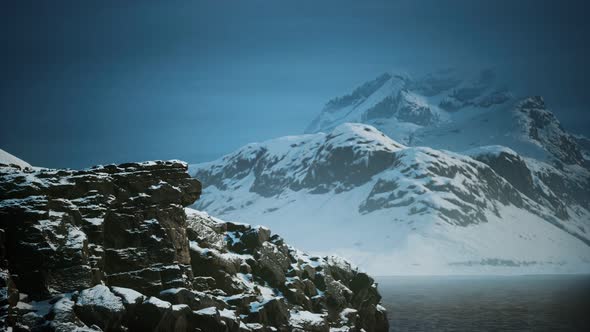 Snow Covered Mountains in Northern Ocean