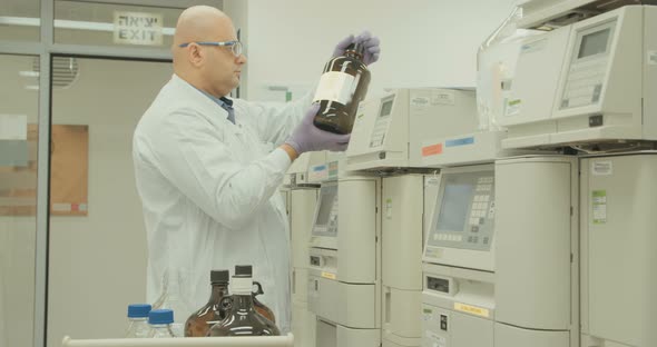 Scientist working with mass spectrometer in a pharmaceutical laboratory conducting experiments