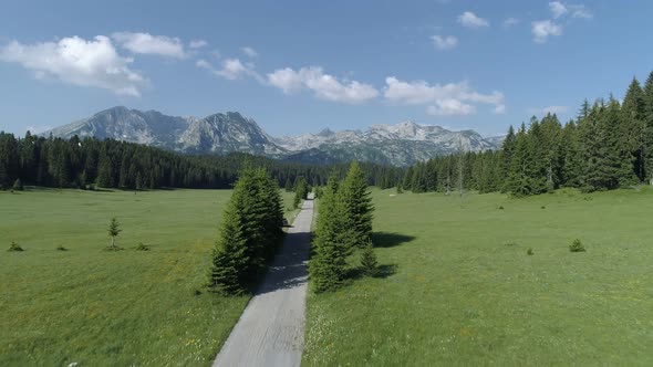 Flight Over the Road Going To High Rocky Mountains, Durmitor National Park, Montenegro, Aerial Drone