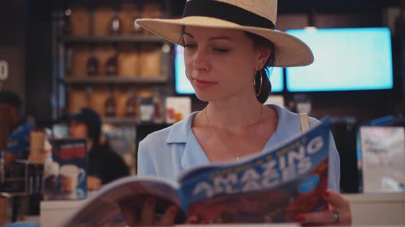 Young girl reading a magazine