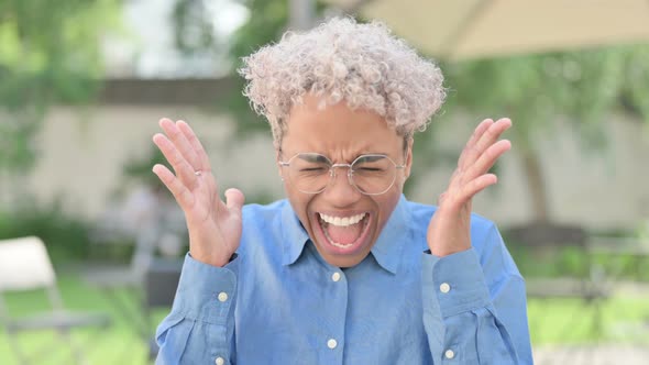 Portrait of Angry Young African Woman Screaming Shouting