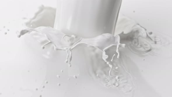 Super Slow Motion Detail Shot of Pouring and Splashing Fresh Milk at 1000 Fps