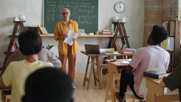 Female Teacher Giving Lesson to Multiethnic College Students