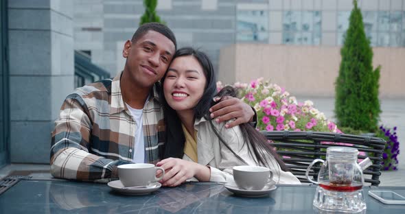 Portrait of Two Beautiful People Attractive Affectionate Happy Multiethnic Couple at Romantic Date