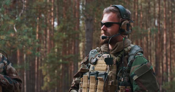 A Portrait of a Bearded Middleaged Commander a Soldier in a Military Uniform Who Provides