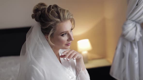 Beautiful and Lovely Bride in Night Gown and Veil. Wedding Morning. Slow Motion