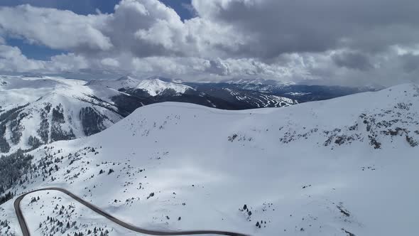 Storm brewing over the peaks on Loveland Pass, Colorado. Aerial views of mountains and highway 6.
