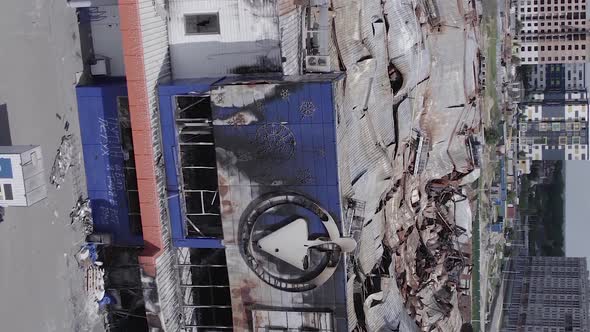 Vertical Video of the Consequences of the War in Ukraine  a Bombedout Shopping Center in Bucha