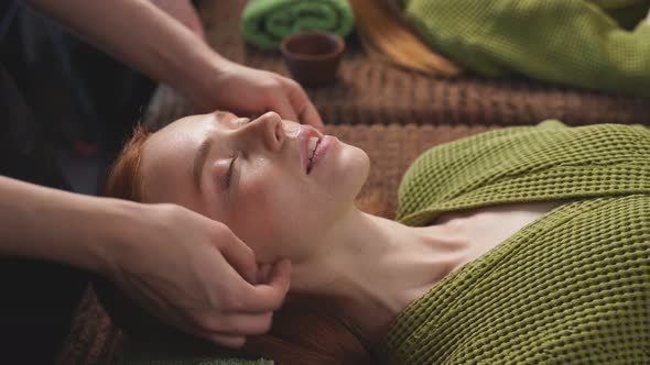 Woman Enjoys a Relaxing Facial Massage at a Beauty Salon