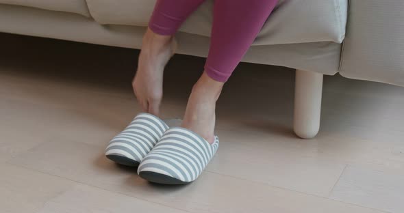 Woman wear slipper at home