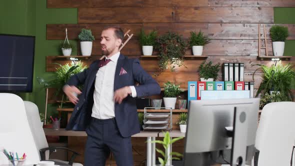 Happy Corporate Worker Dances Alone in the Office