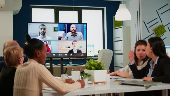 Emplyees Workers Having Webcam Conference with Coworkers Speaking on Video Call