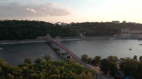 Aerial view of the Dnipro river near the city of Kiev with the People's Friendship Arch in the hill.