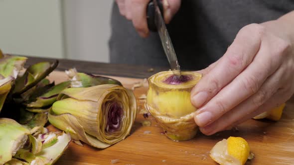 Woman Cut Artichoke