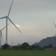 Wind Farm with Large Blades Rotating on Windmills on Meadow - VideoHive Item for Sale