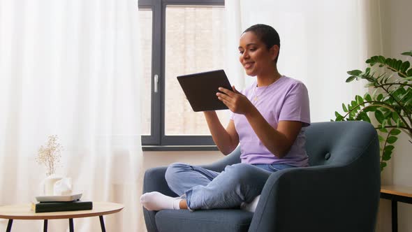 African American Woman with Tablet Pc at Home