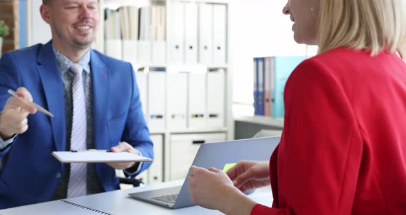 Business Man Giving Document to Woman Partner to Sign  Movie Slow Motion