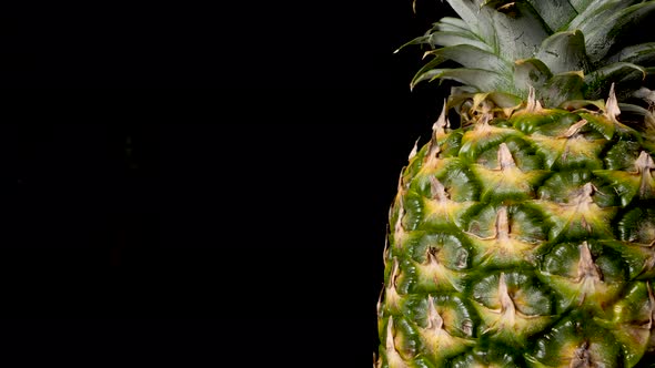 Ripe Pineapple Fruit - Extreme Closeup Panning View with Black Background
