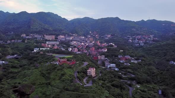 Aerial view of buildings in Jiufen village on mountain hill in Taipei, Taiwan.