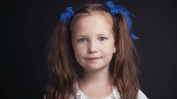 Footage Portrait Pretty Young Girl on Dark Background.