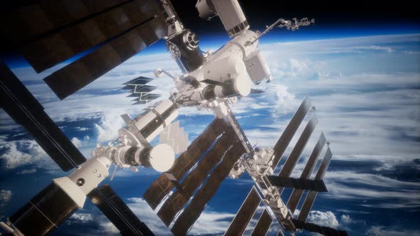 A View of the Earth and a Spaceship. ISS Is Orbiting the Earth alt