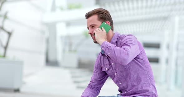 Young Man Use of Mobile Phone in The City