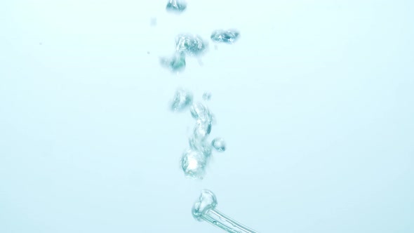 Water Bubbles Going Up In White Background