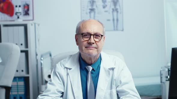 Authentic Portrait of Elderly Experienced Doctor