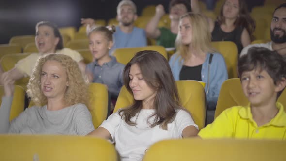 Group of People Throwing Popcorn in Cinema. Portrait of Angry Film-lovers Dissatisfied with Film