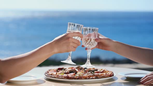 Group Man and Woman Friends Enjoy Party Drinking Champagne Together at Summer Sunset