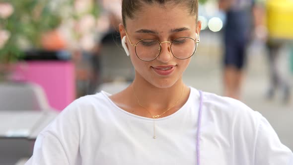 Portrait Close Up of Young Beautiful Girl on Street