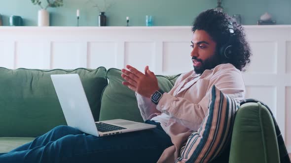 Young Arabian Man in Headphones Remote Call Center Employee Works From Home