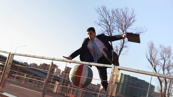Businessman in Jacket and Tie Jumps Over an Obstacle on Background City