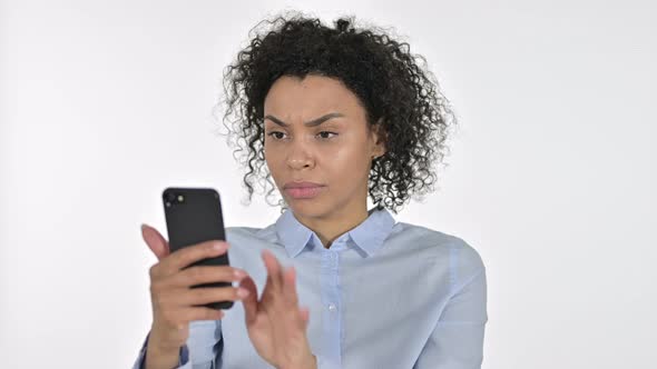 Portrait of Sad Young African Woman Getting Loss on Smartphone