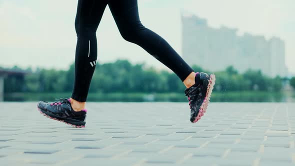 Runner Woman Runs In Park. Legs Jogging In Sport Shoes. Fitness Girl Running Exercise. Run On Sand.
