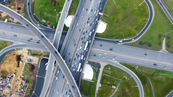 Drone flies over the road urban junction. Highway in Moscow. Bird's eye view.