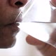 man drinking water from a glass on white background stock video stock footage - VideoHive Item for Sale