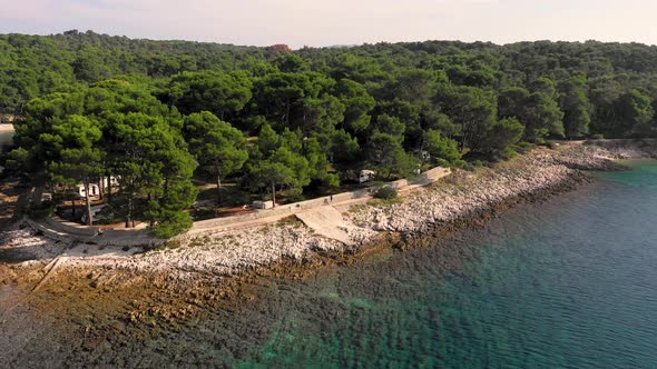 Aerial view of man running at Losinj costaline, Croatia.