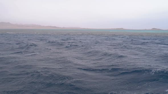 View From the Ship on the Waves and the Coast of Egypt in Stormy Weather