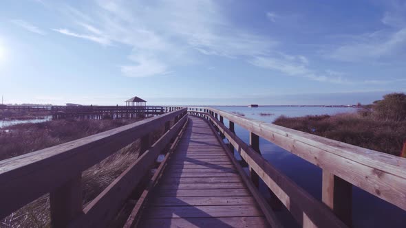 Wooden Path in the Lagoon at Sunset