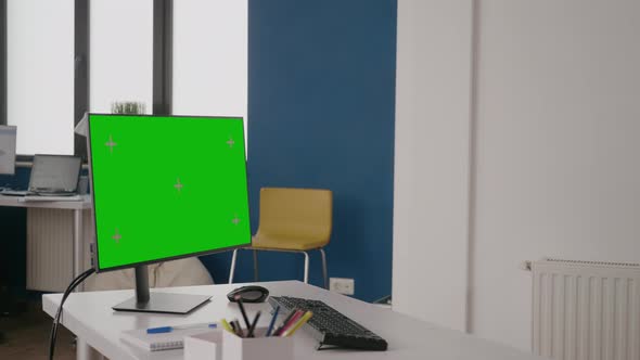 Company Worker Using Green Screen on Computer