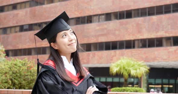 Woman wearing graduation gown