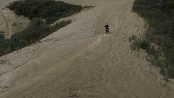 Enduro Motorcycle Rides Offroad on the Sands